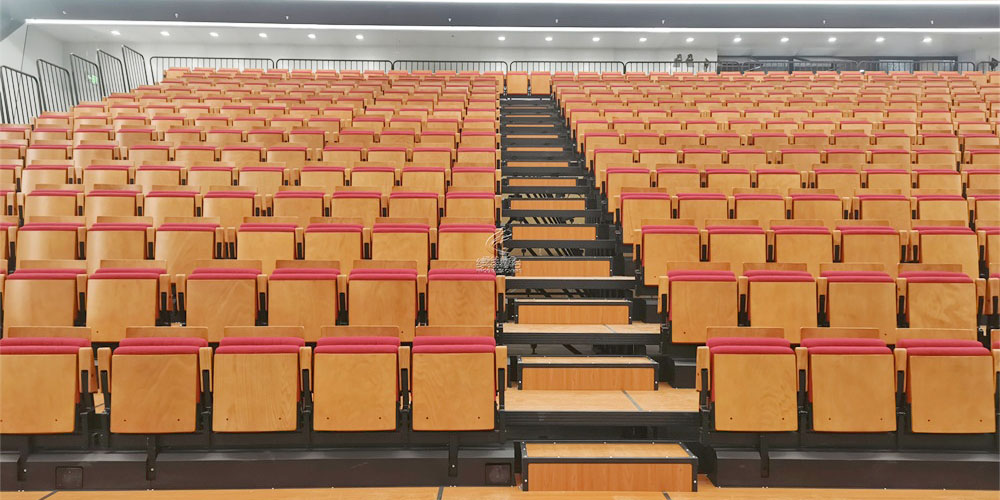 伸縮看臺(tái)座椅的“機(jī)械骨骼”：驅(qū)動(dòng)系統(tǒng)、軌道材質(zhì)與安全保障全解析